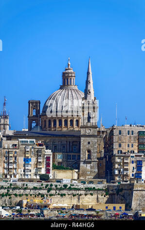 Basilica of Our Lady of Mount Carmel and St. Paul`s Pro-Cathedral in the foreground, Valletta, Malta Stock Photo